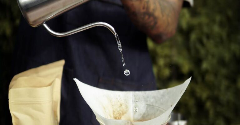 Cafes - Person Pouring Milk on Clear Glass Cup