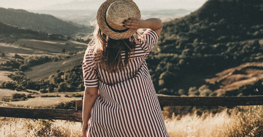 Views - Selective Focus Photography of Woman Holding Brown Straw Hat