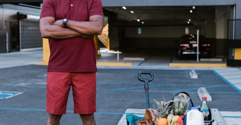 Hubs - A Man in Red Polo Shirt Standing beside a Cart